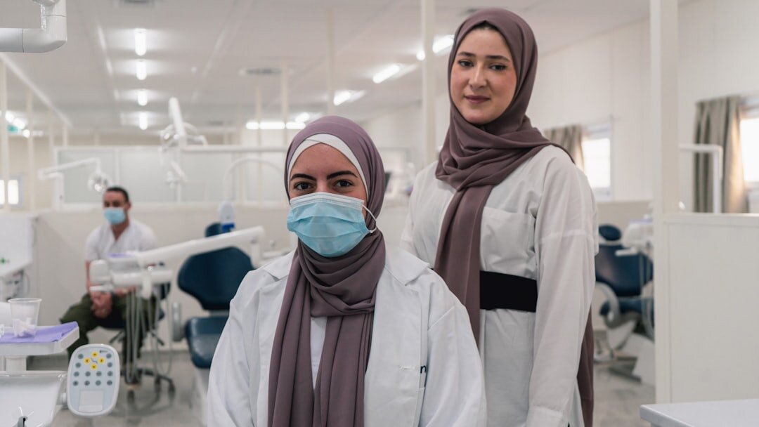 Small diverse team of researchers smiling together indoors